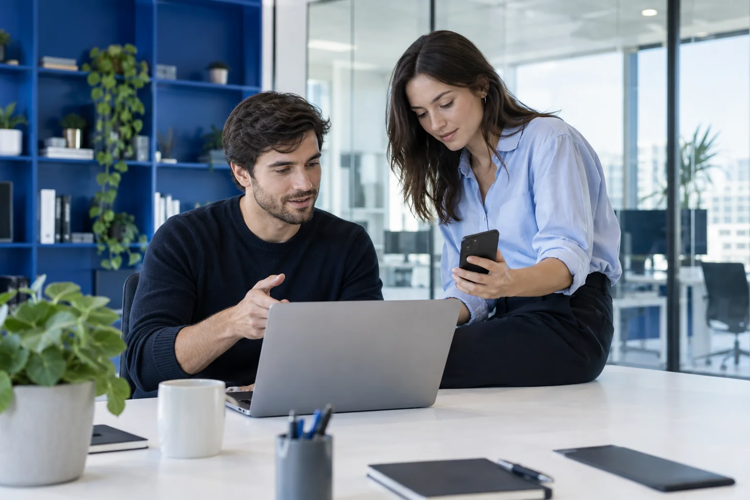 Technology colleagues comparing a software prototype across devices.